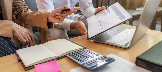 A person reviewing tax documents at a well-organized desk