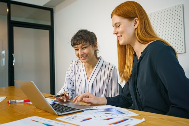 A person thoughtfully reviewing financial planning documents with a clear desk and natural light